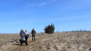Marlys Kerkman, Marnie Clement, and Thom Unrau at John Earle Chase Memorial Park in Trent Lakes