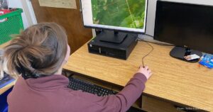 Rylee Goerlitz using a GIS computer