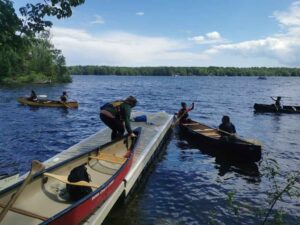 People canoeing off of Kawartha Land Trust's Big Boyd Chiminis Island in Pigeon Lake in Kawartha Lakes