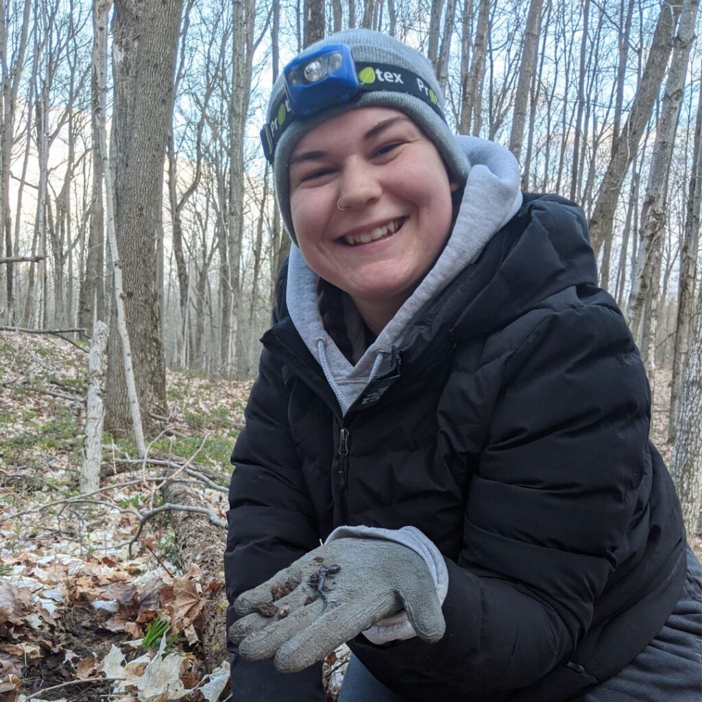 KLT volunteer holding a salamander in fall in Kawarthas