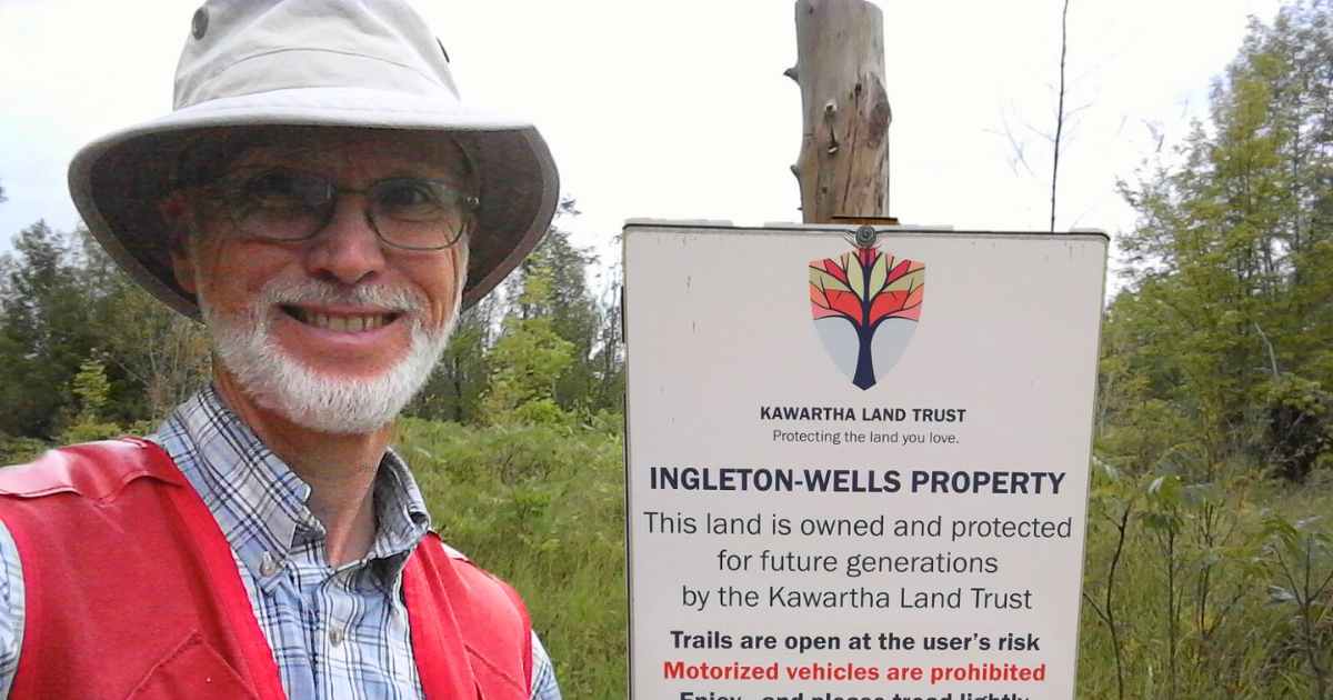 Richard Raper standing at Ingleton-Wells property trailhead in North Kawartha.